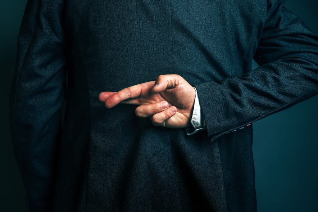 Man crossing fingers behind his back cheating statistics uk